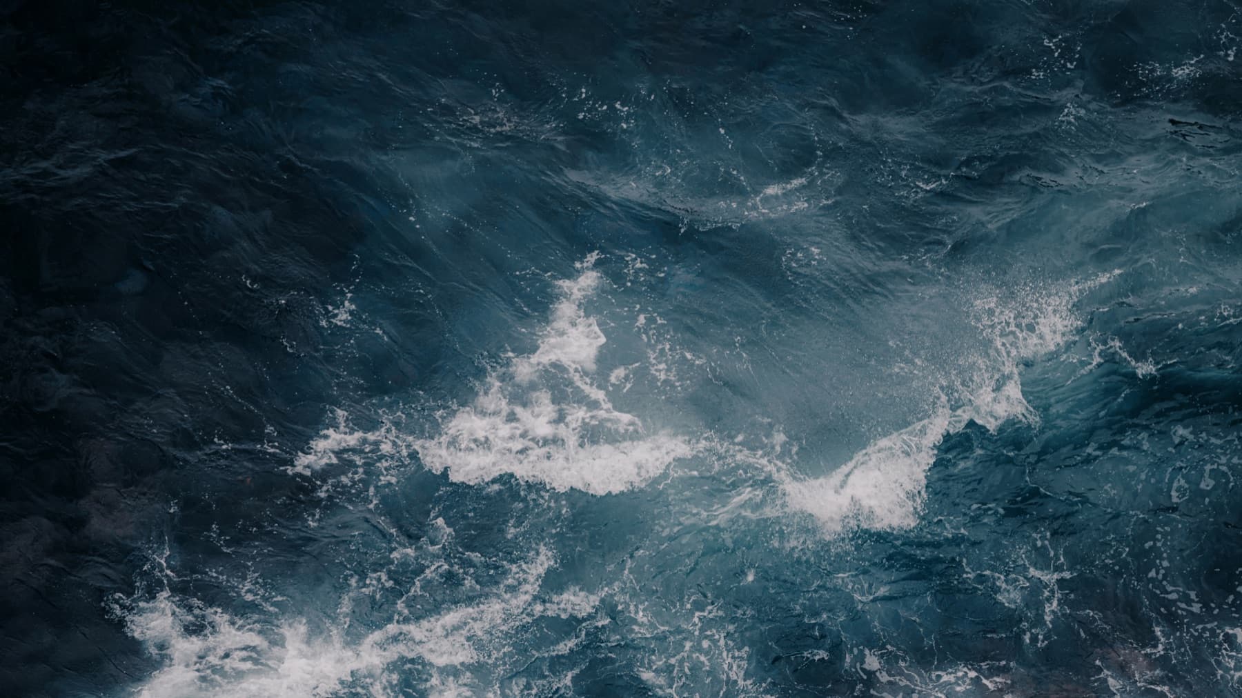 Aerial view of dark ocean surf