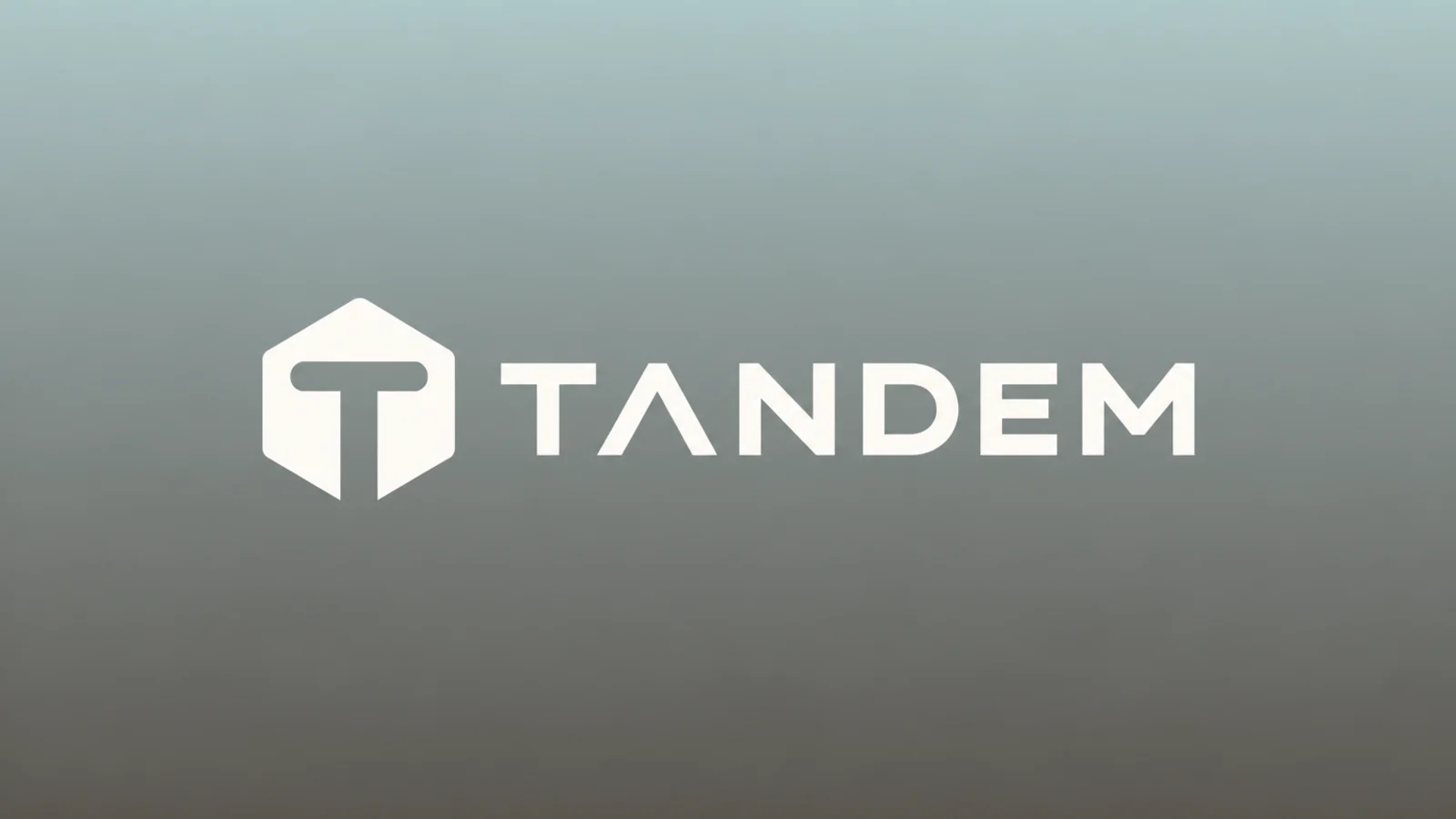 Tandem logo on a misty graphite gradient