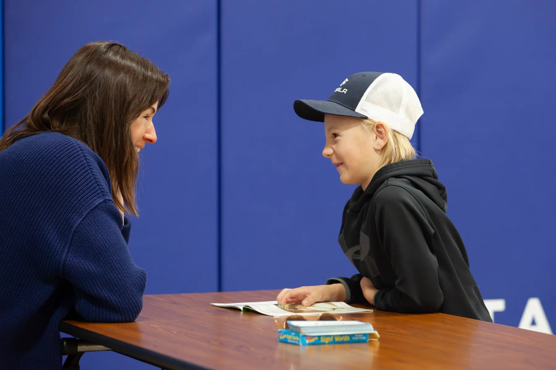 A volunteer and student sharing a moment during a ROW session
